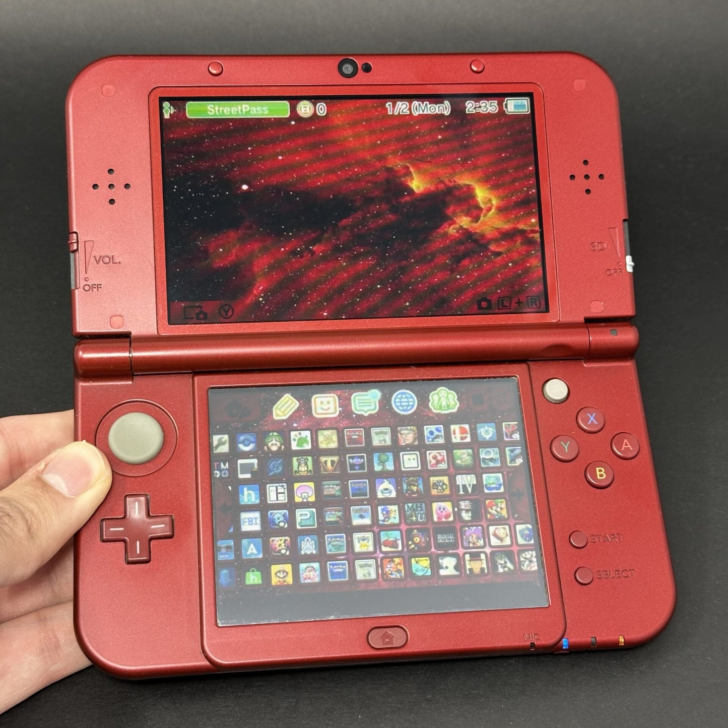 New Nintendo 3DS XL (64GB) – 600+ Games | Metallic Red image 0