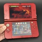 New Nintendo 3DS XL (64GB) – 600+ Games | Metallic Red