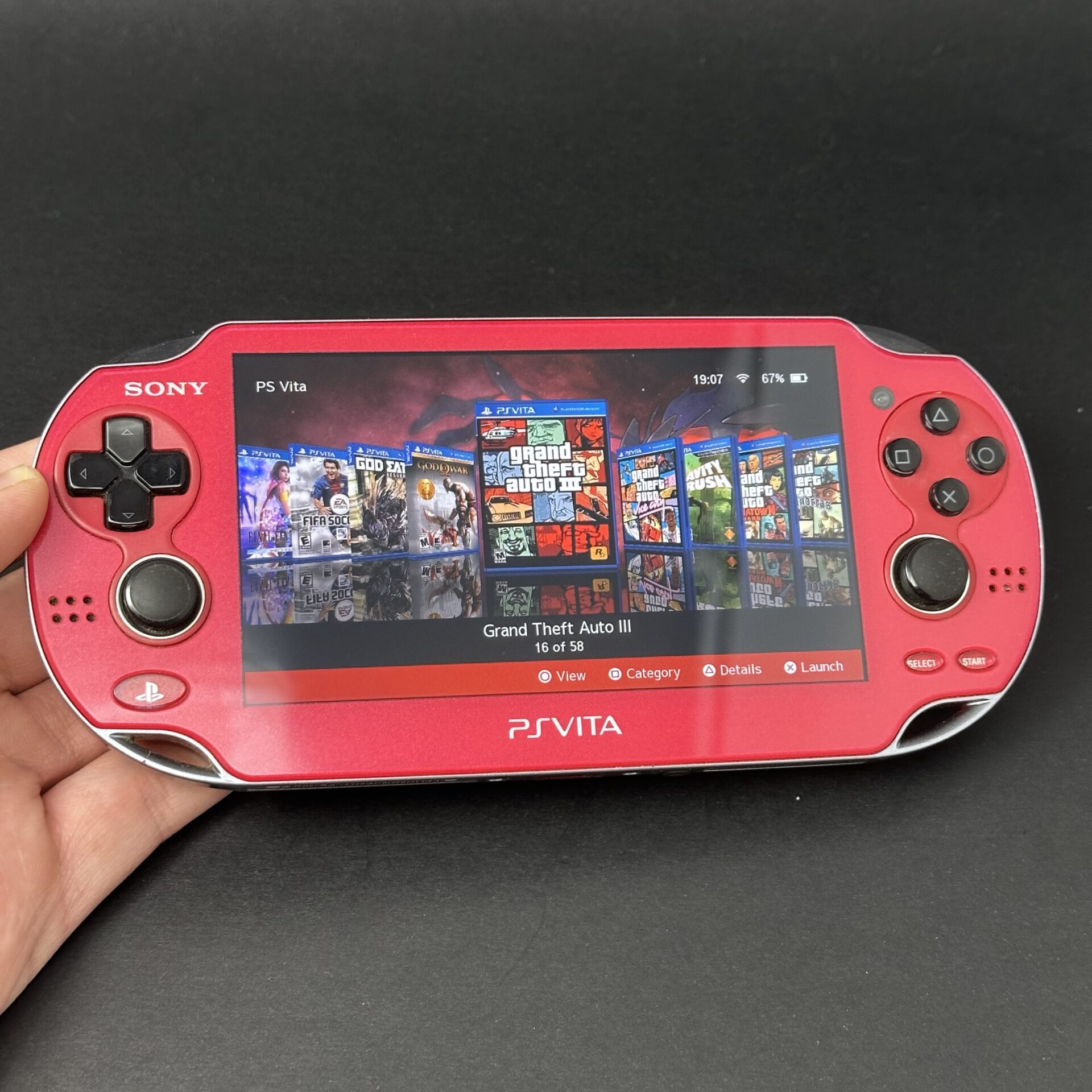 PS Vita OLED (128GB) – 580 Games | Cosmic Red – Samtendo