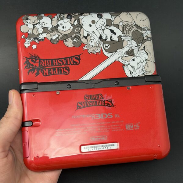 img_0773.jpeg Nintendo 3DS XL (64GB) – 600+ Games | Smash Bros Red