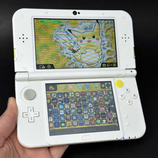 img_4294.jpeg New Nintendo 3DS XL (64GB) – 600+ Games | White and Yellow Pikachu (DUAL IPS)